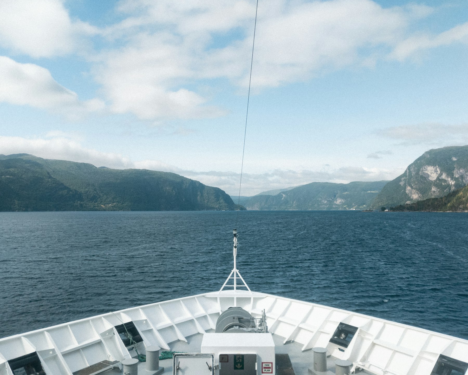 The bow of a coastal ship heading into the fjords